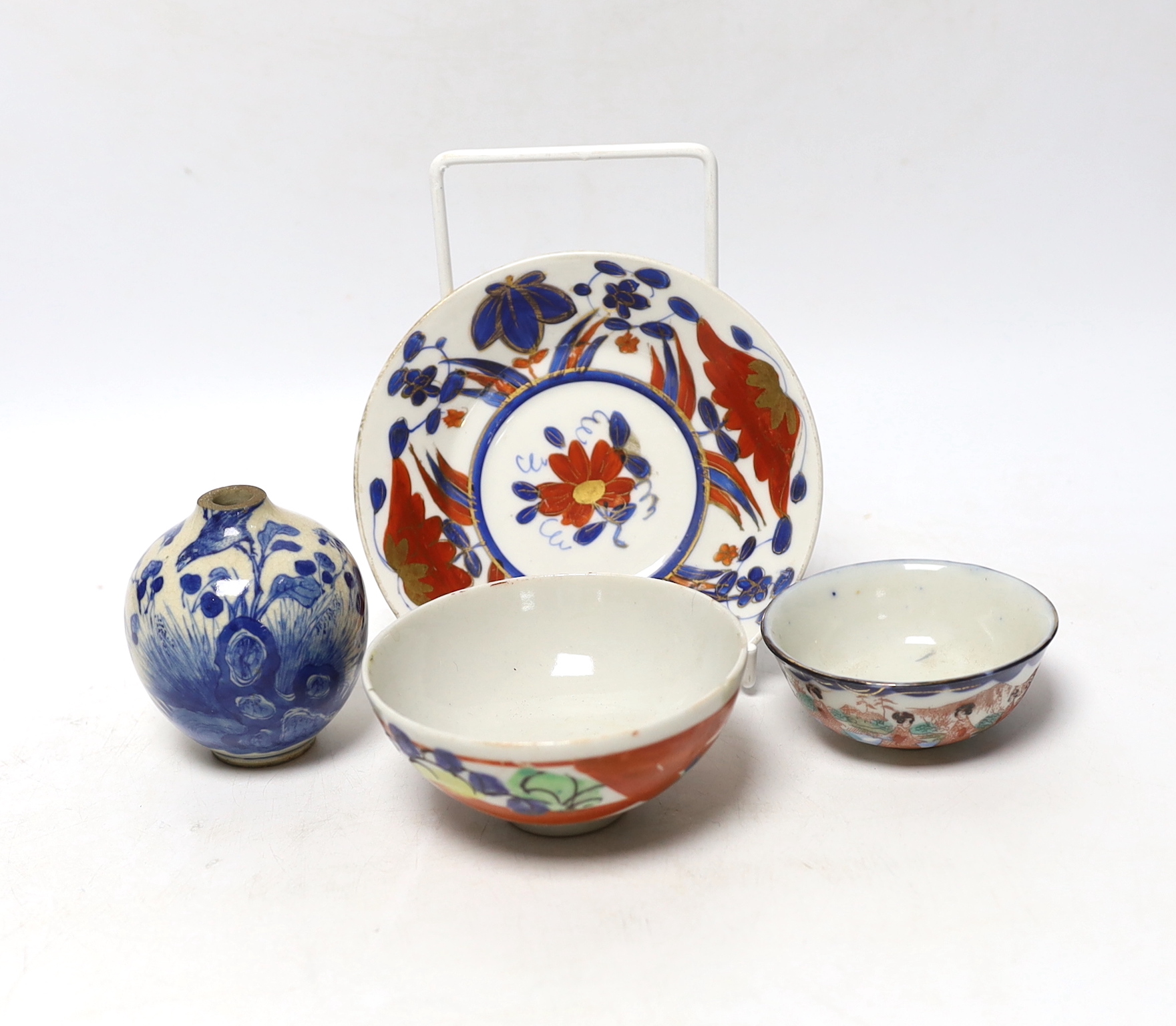 A Chinese soft paste porcelain miniature vase, two small bowls, and a small dish, vase 7cm (4)